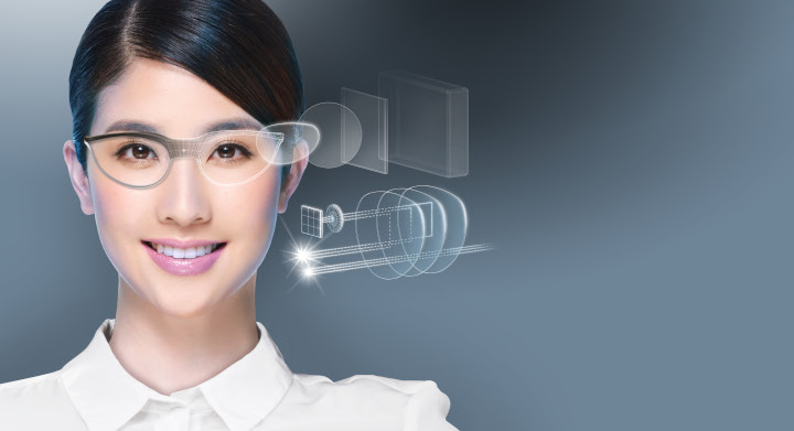 SCHOTT RealView® glass wafers are key components of smart glasses that deliver augmented reality Young woman in a white shirt wearing augmented reality glasses